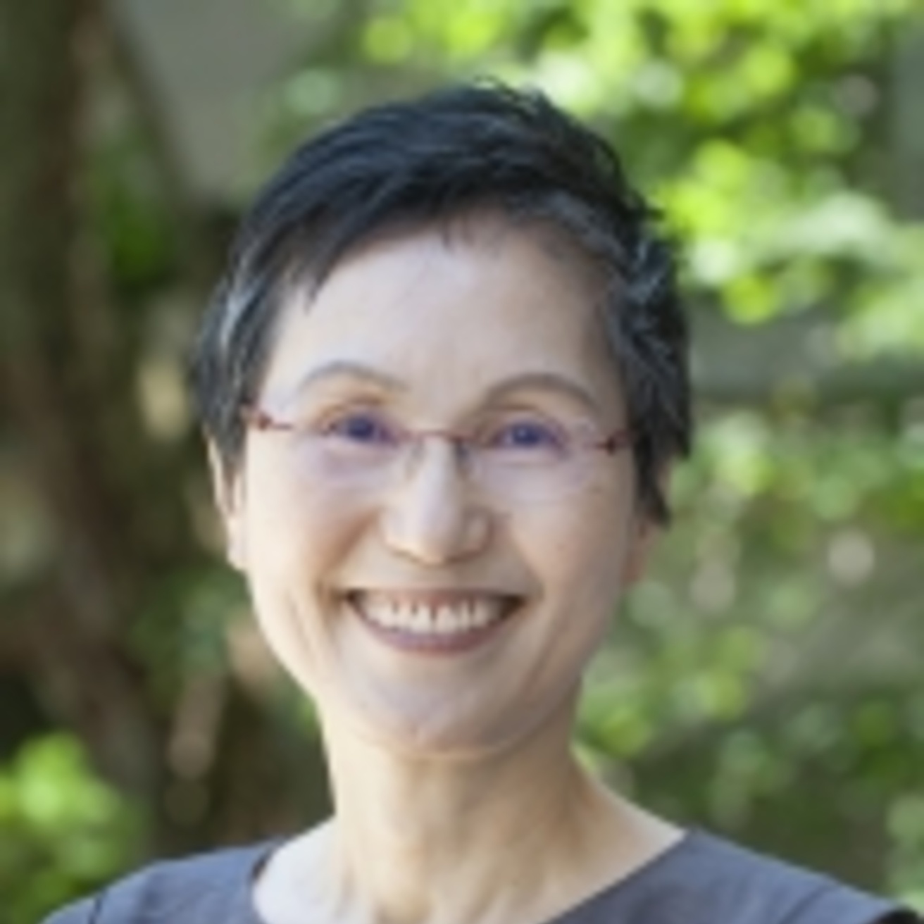 Asian woman with short hair smiling